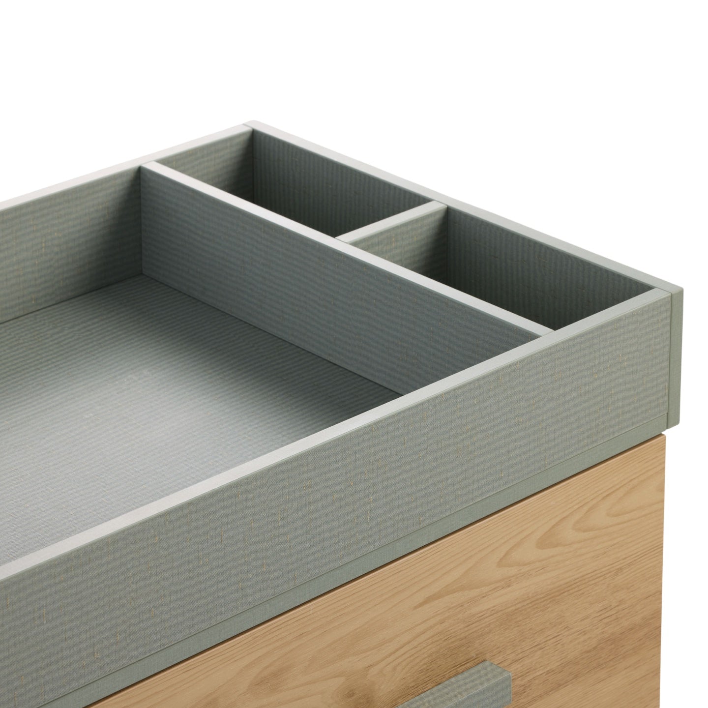 Close-up of the Hallee chest changer in sage weave and golden oak showing textured changing surround with built-in organiser sections.