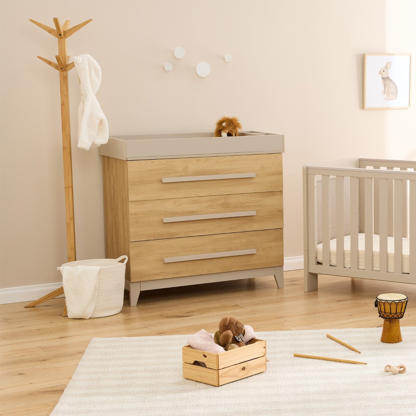 Hallee chest changer in mushroom and golden oak with three spacious drawers and removable changing top in neutral nursery.