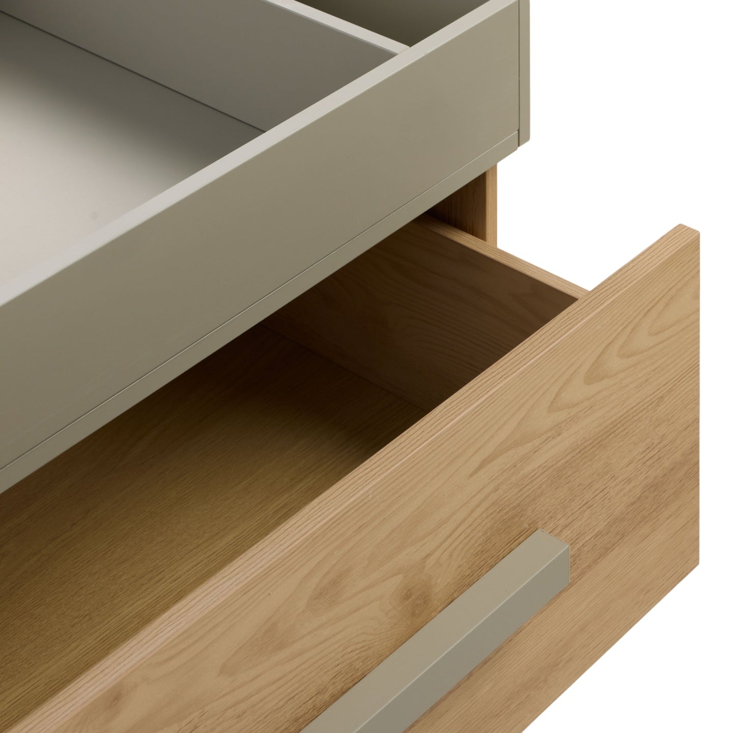 Detail of Hallee chest changer in sage and golden oak highlighting wood grain finish and minimalist sage handles.
