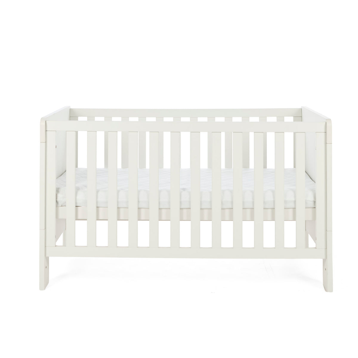 A cashmere Alba cot bed with vertical slats and a mattress inside, shown against a plain white background.