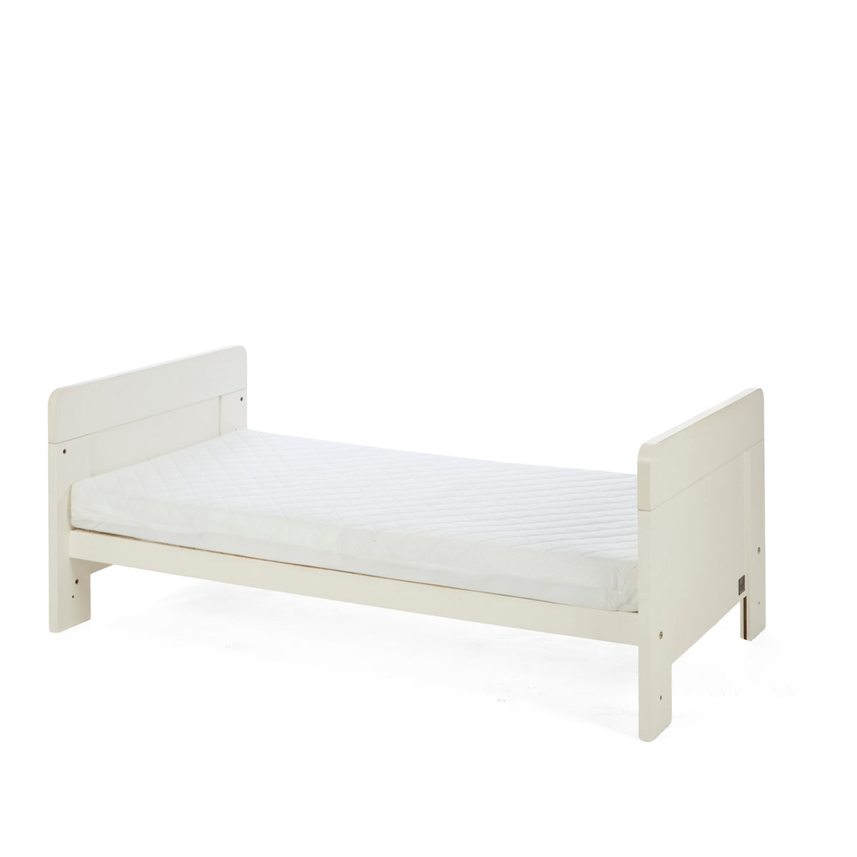 A side view of the Alba cot bed in cashmere converted into a toddler's bed in a white background.
