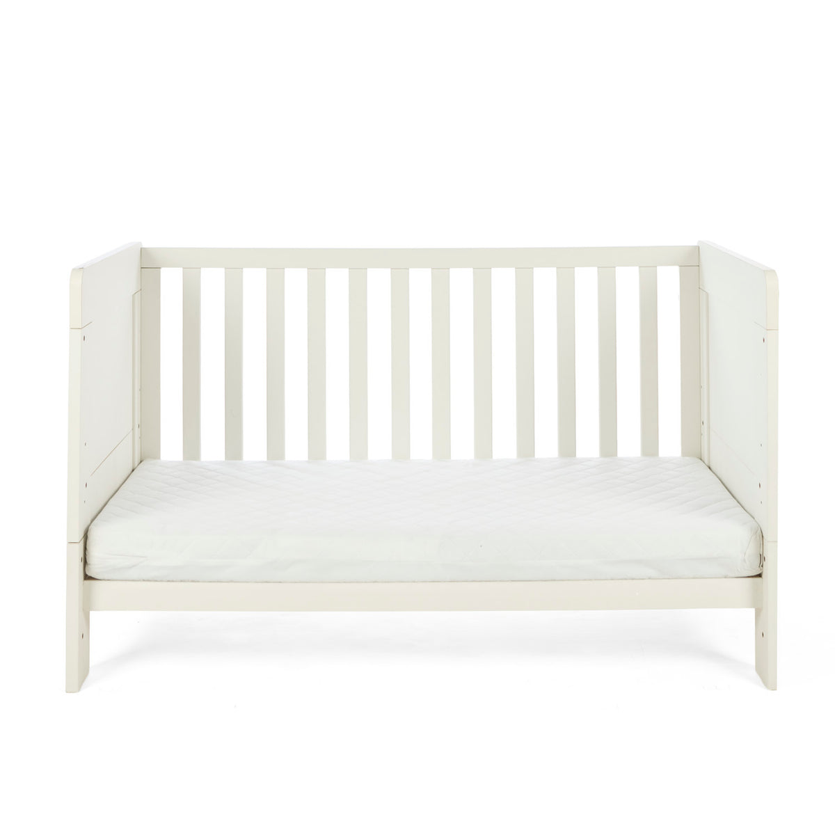 The Alba cot bed in cashmere converted into a toddler's sofa in a white background.