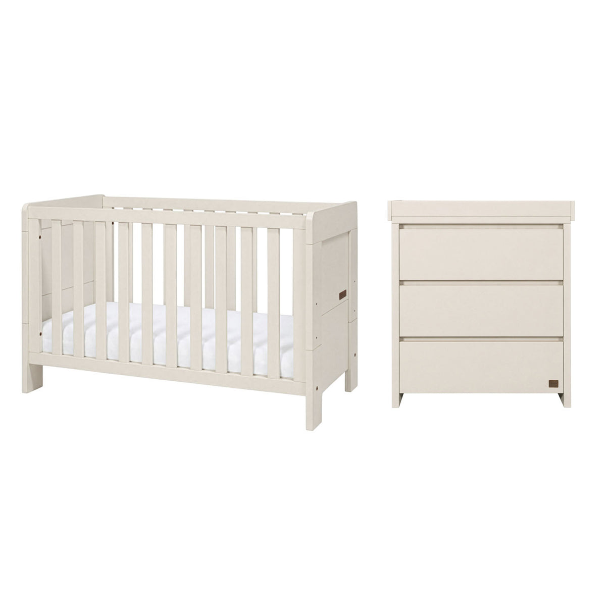A baby furniture set featuring a convertible cot bed and a three-drawer changing unit, both finished in a warm off-white/cream color, against a white background.