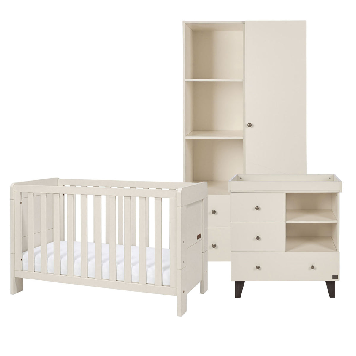 A three-piece nursery furniture set in a cashmere white finish, including a convertible cot bed, a changing table with drawers, and a tall wardrobe with shelves, shown on a solid white background.