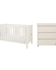 A white convertible cot bed and matching three-drawer nursery dresser with a removable baby-changing units, shown side by side on a plain white background.