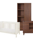 A baby furniture set including a white convertible cot bed, a dark brown wooden wardrobe, and a matching changing table with drawers and shelves, shown on a solid white background.