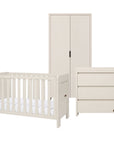 A three-piece nursery furniture set in a white cashmere finish, including a convertible cot bed, a tall two-door nursery wardrobe, and a three-drawer changing table, shown on a solid white background.