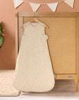 Love Cats baby sleep bag hanging in a nursery, styled with soft bunting and coordinating bedding for a calm, cohesive look