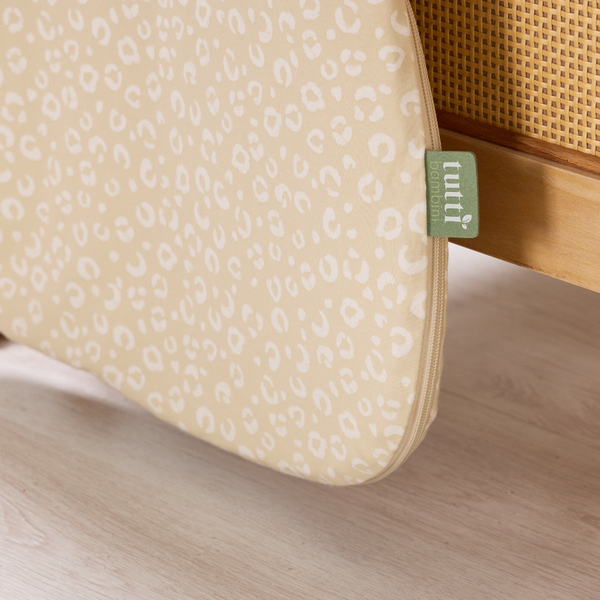 Close-up of Love Cats baby sleep bag zip detail, showing the neat side opening and smooth cotton fabric with subtle illustrated pattern