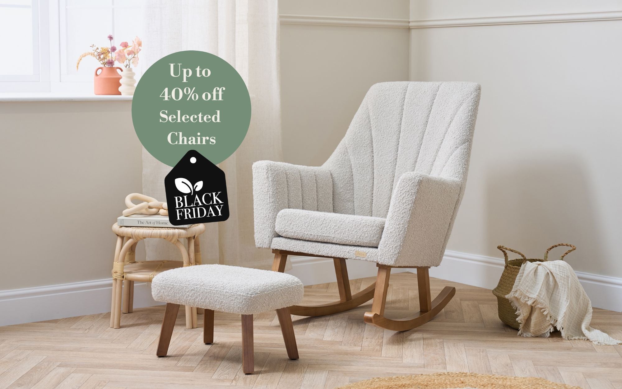 White rocking chair with ottoman in a room with a 'Black Friday' sale tag.