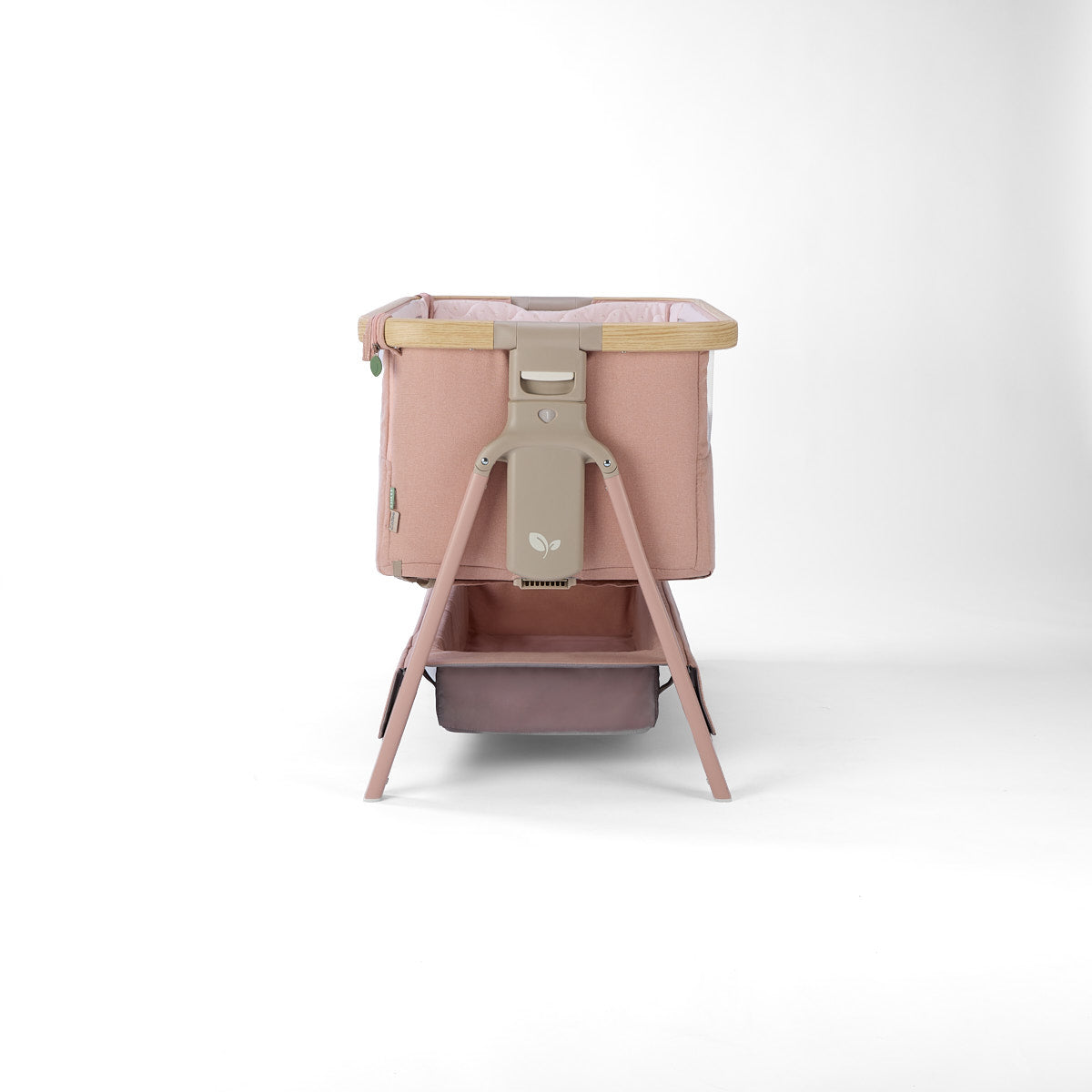 CoZee Air 2 bedside crib in blush with 6 height positions and storage in a white background 