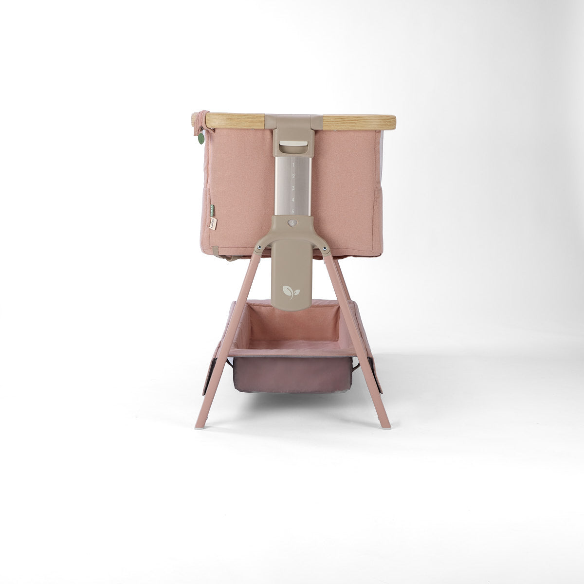 CoZee Air 2 bedside crib in blush with 6 height positions and storage in a white background 