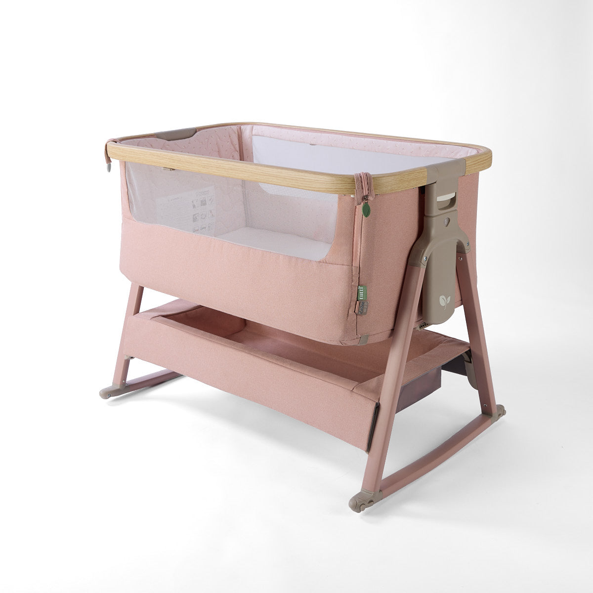CoZee Air 2 bedside crib in blush with rocking bars, storage, 6 height positions in a white background 