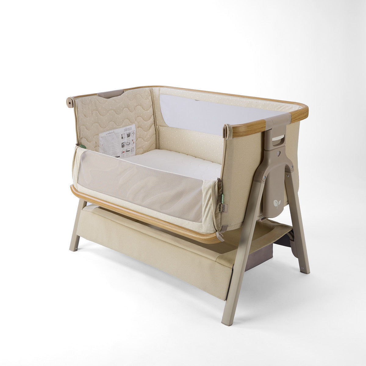 CoZee Air 2 bedside crib in sand, with open side, storage, 6 height positions in a white background 