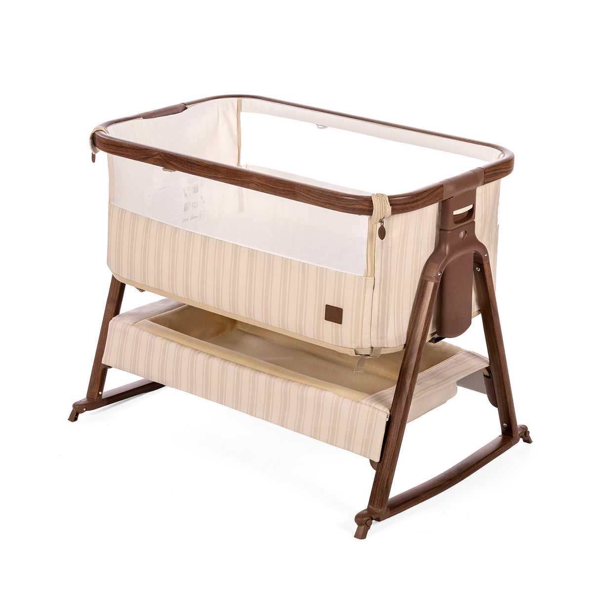 A baby bedside crib with a cashmere vintage stripe and a dark rich walnut frame, shown on a clean white background.