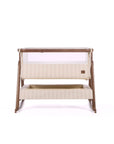 CoZee Air 2 bedside crib in rich walnut and cashmere vintage stripe on a white background.