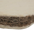 Close-up view of the CoZee mattress showing natural wool layers and breathable coir fibre core for firm, supportive comfort.