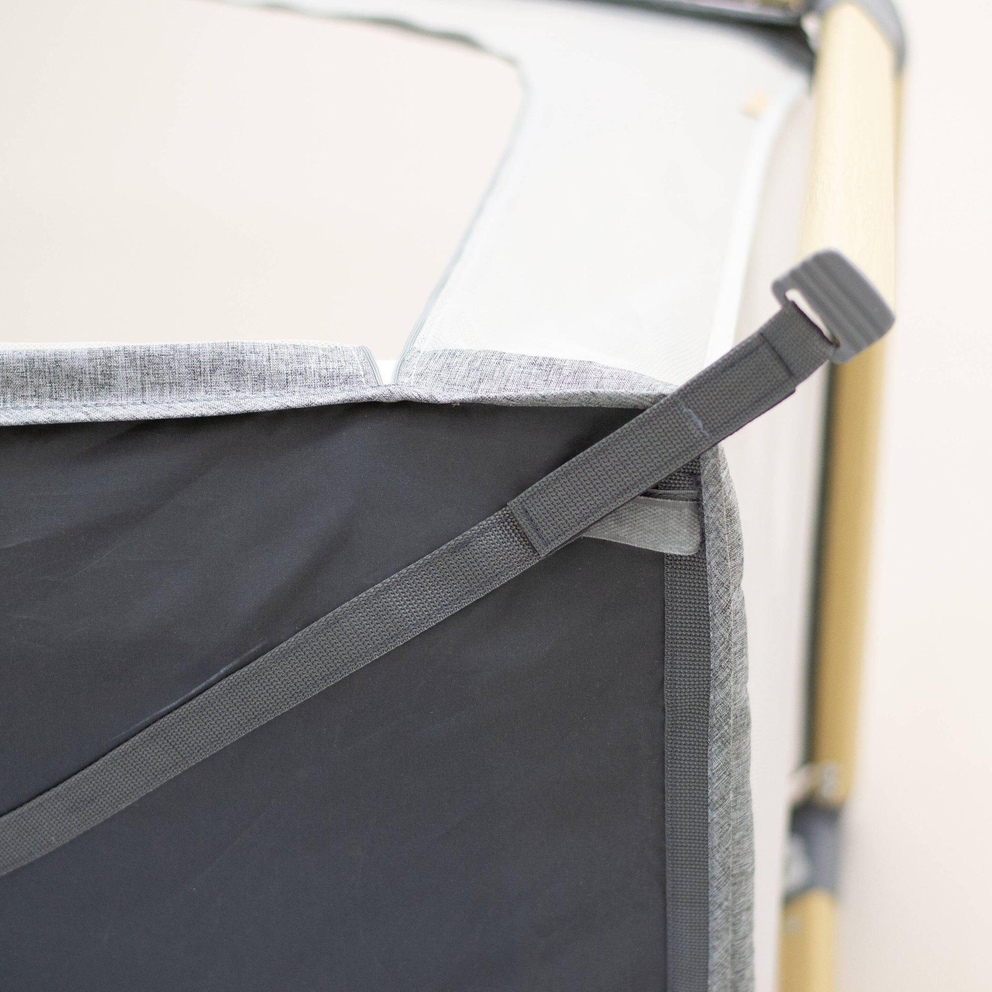 Close-up of a gray bag with a strap, for the CoZee Go travel bag.