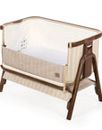 A CoZee Air in a cream-colored striped fabric body and a dark brown wooden frame, shown on a white background.