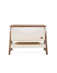 CoZee Air bedside crib in rich walnut and cashmere vintage stripe on a white background.
