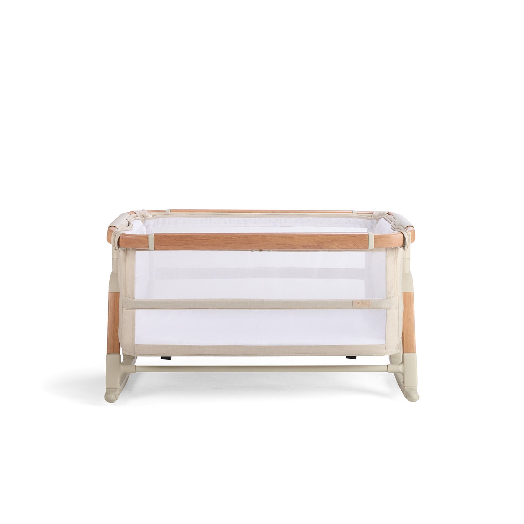 Cutout view of the CoZee bassinet in Scandi finish, shown in rocking mode with mesh panels and curved legs for gentle soothing