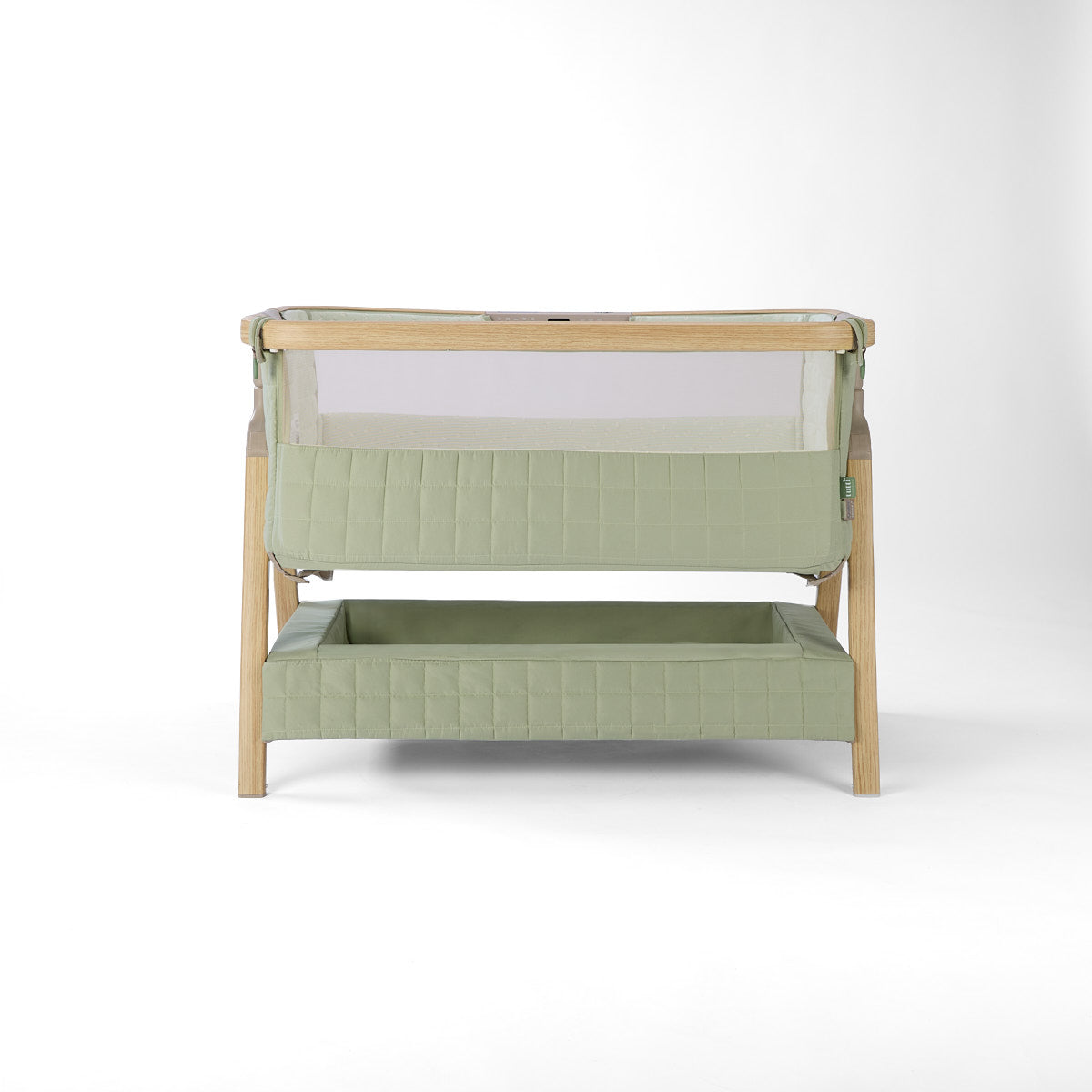 CoZee Sense green baby crib with mesh and quilted lining sides, storage and sensory bar on a white background