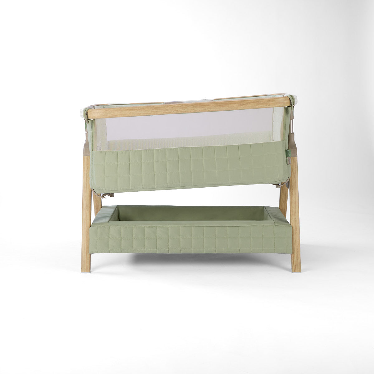 CoZee Sense green baby crib with mesh and quilted lining sides, inclined option, storage and sensory bar on a white background