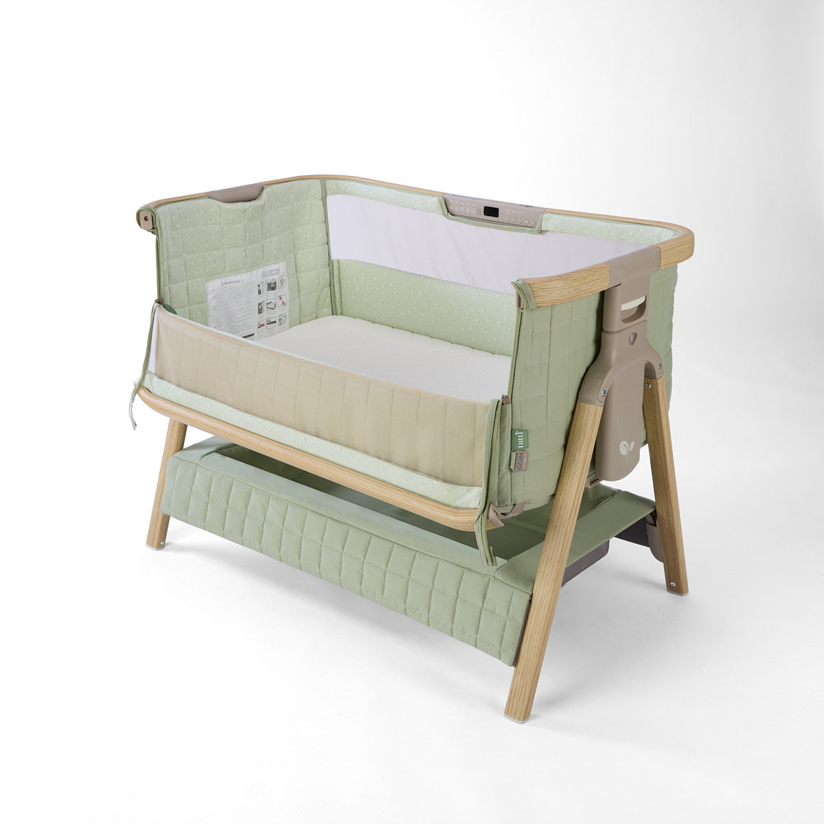 CoZee Sense green baby crib with mesh and quilted lining side open, storage and sensory bar on a white background