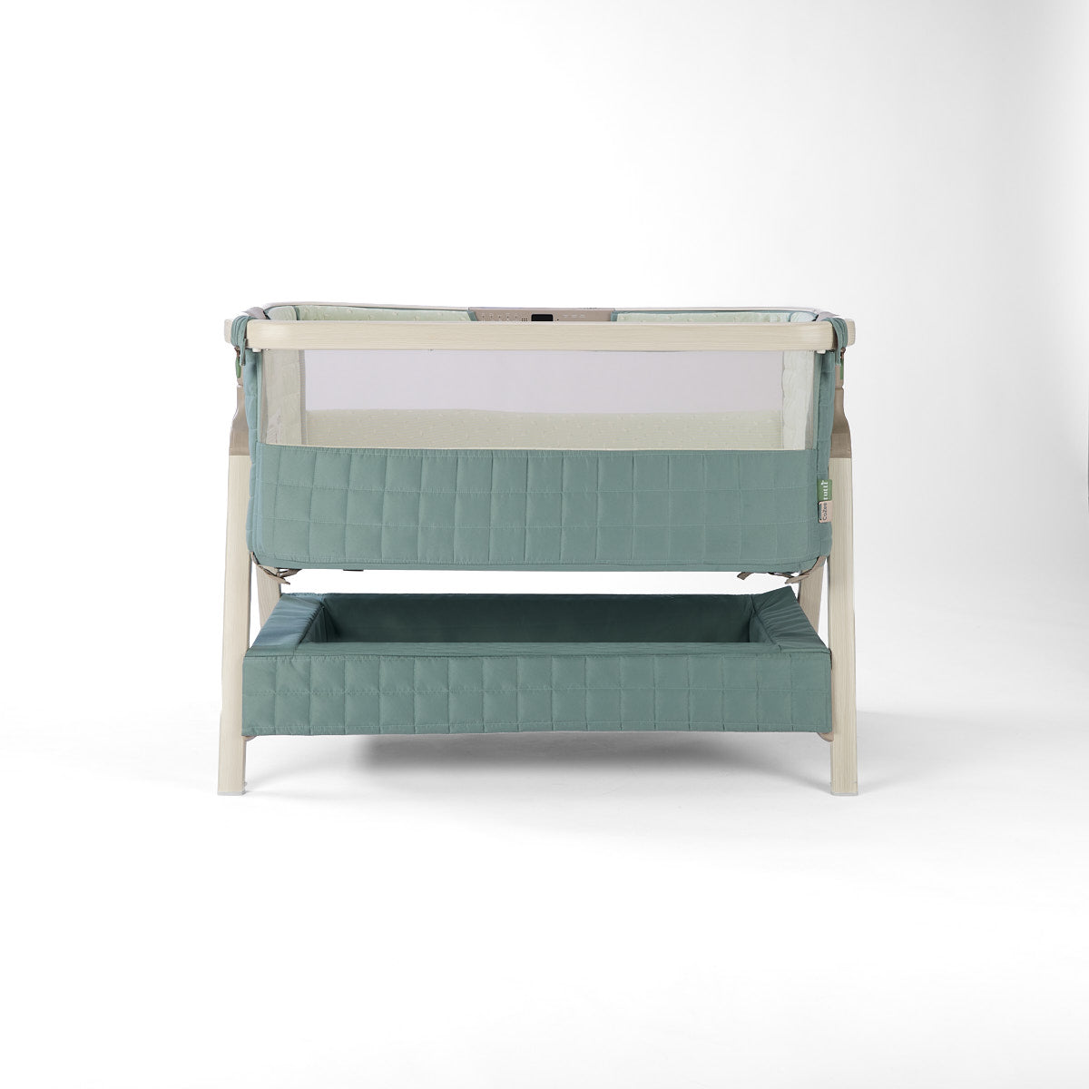 CoZee Sense green baby crib with mesh and quilted lining sides, storage and sensory bar on a white background
