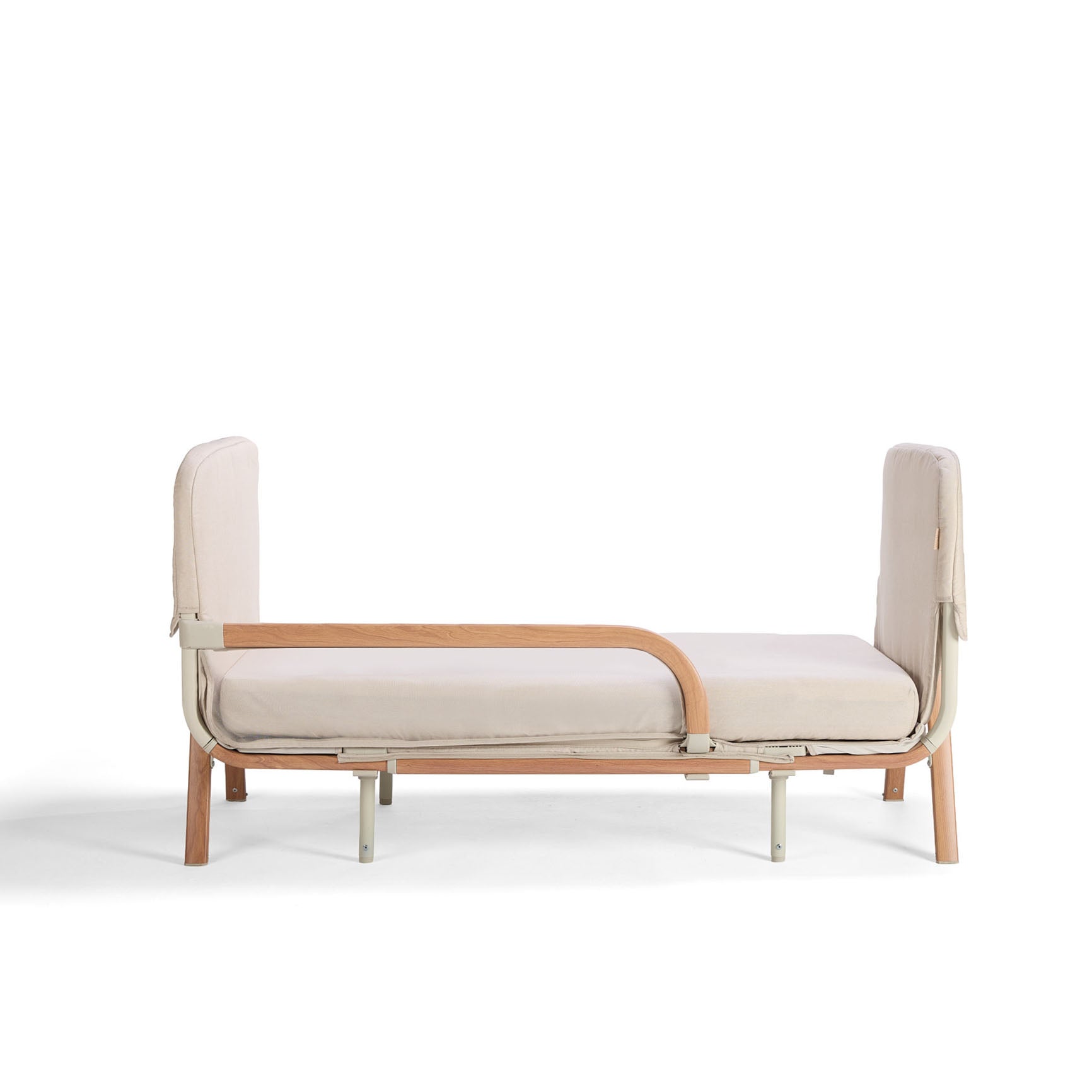 Cutout of the CoZee XL Scandi in junior bed setup, with open side rail and supportive frame for toddler use