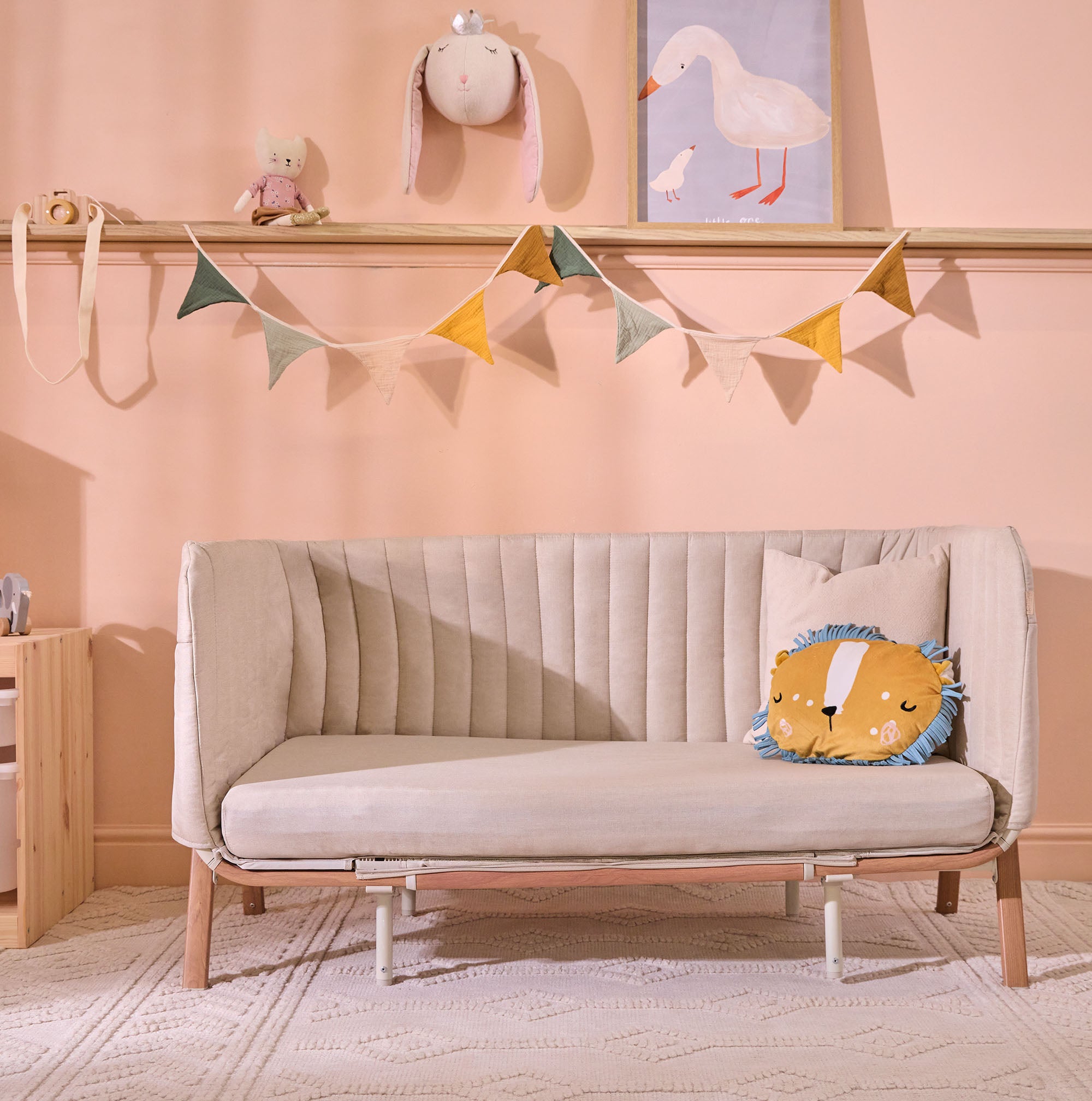 CoZee XL Scandi converted into sofa mode, styled in a soft peach nursery with bunting and playful lion cushion detail