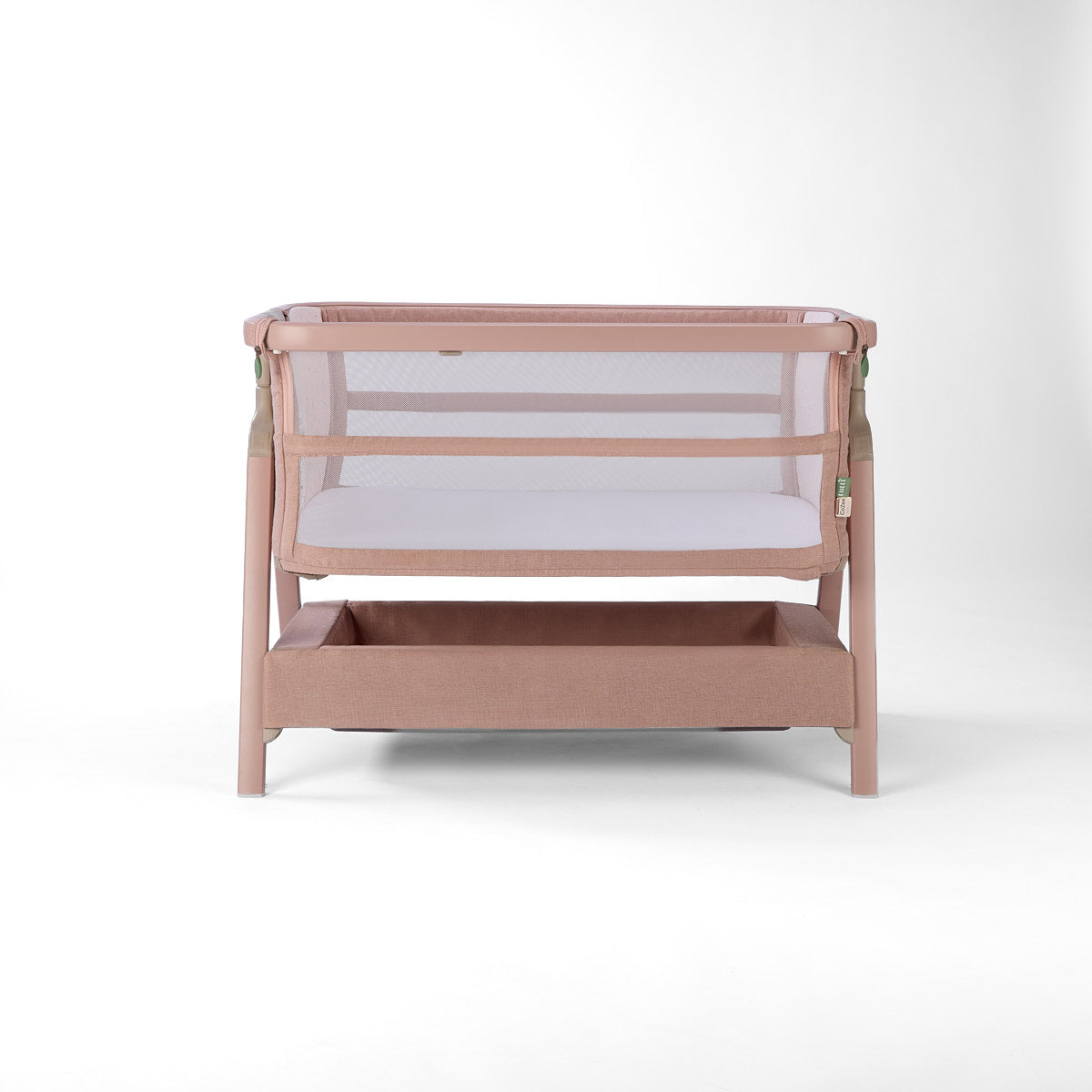 CoZee Zen pink baby crib with mesh sides on a white background