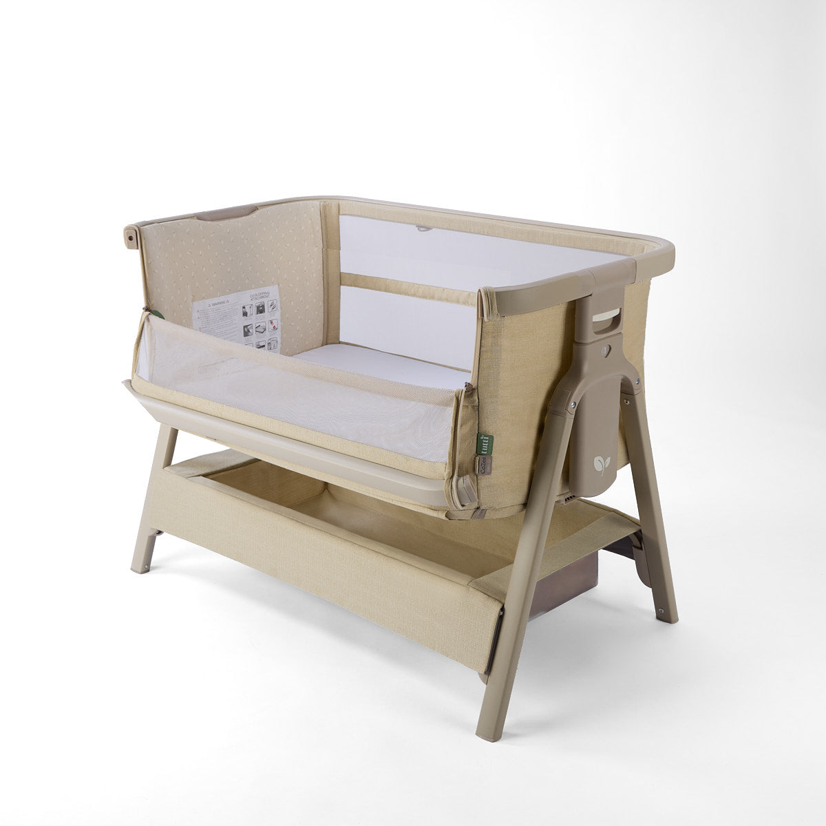 CoZee Zen sand baby crib with side open and white mattress on a white background