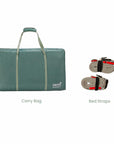 Cutout image of CoZee Zen bedside crib accessories including carry bag and secure bed straps for travel and bedside use.