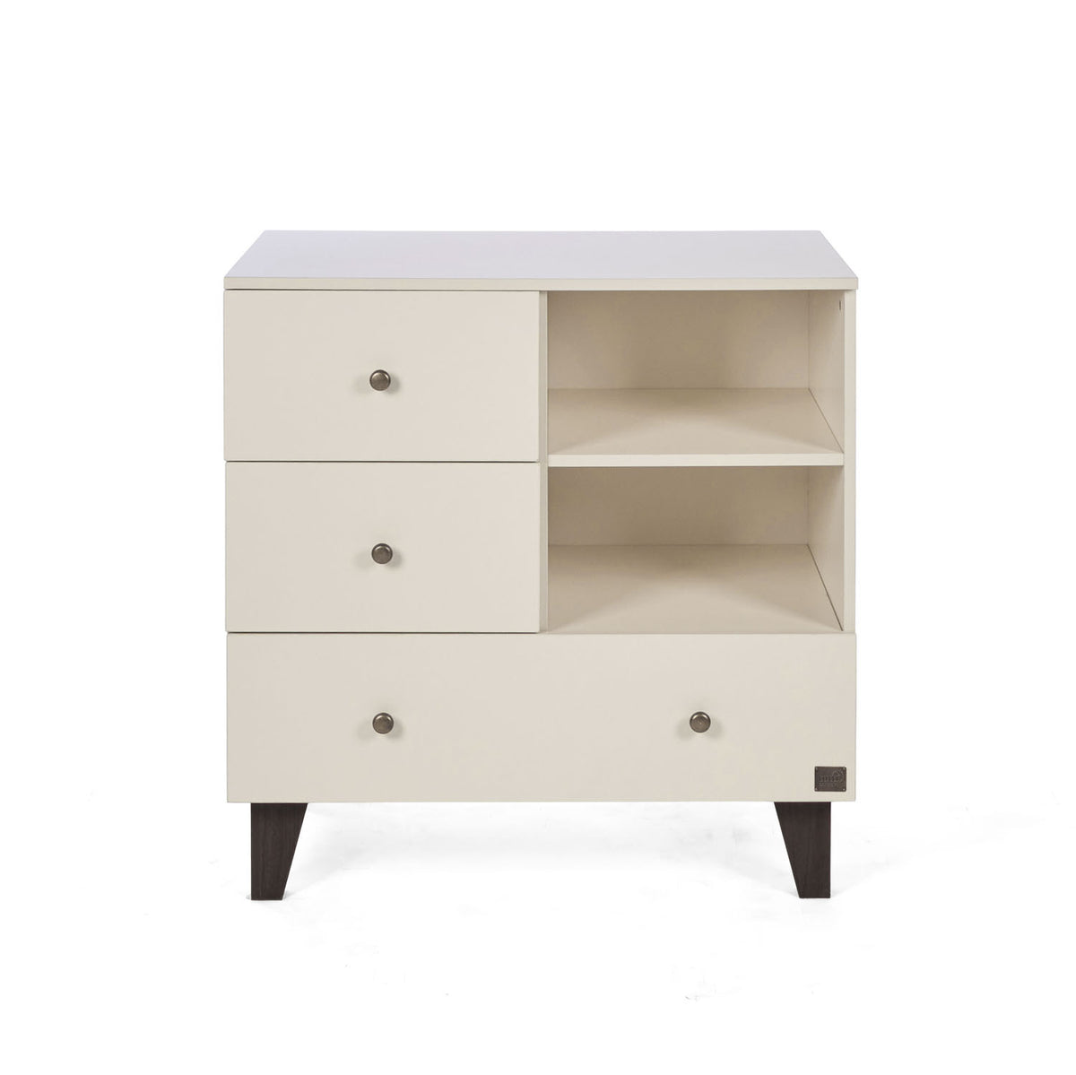 A front view of the Como chest changer in cashmere with three drawers and open shelving for organised nursery storage.