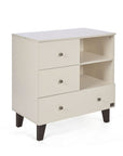 A side view of the Como chest changer in cashmere with three drawers and open shelving for organised nursery storage.