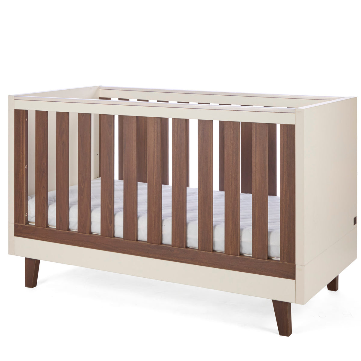 An angle view of the Como cot bed in cashmere and rich walnut, featuring wooden slate slats in a sturdy, modern frame.
