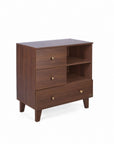 A side view of the Como chest changer in walnut with three drawers and open shelving for organised nursery storage.