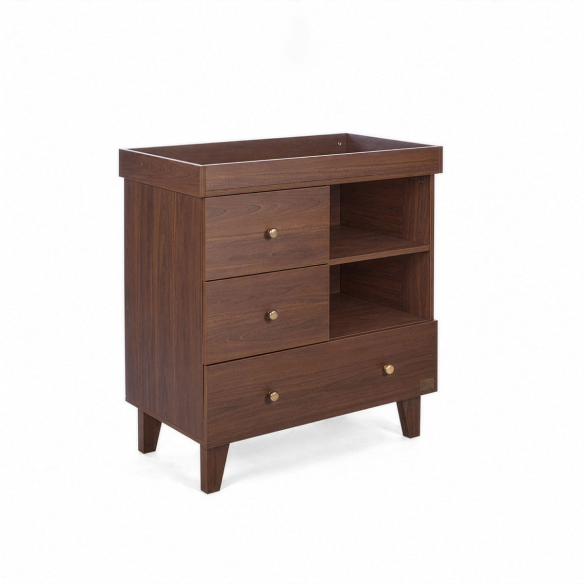 A side view of the Como chest changer in walnut with a removable changing top, three drawers and open shelving for organised nursery storage.