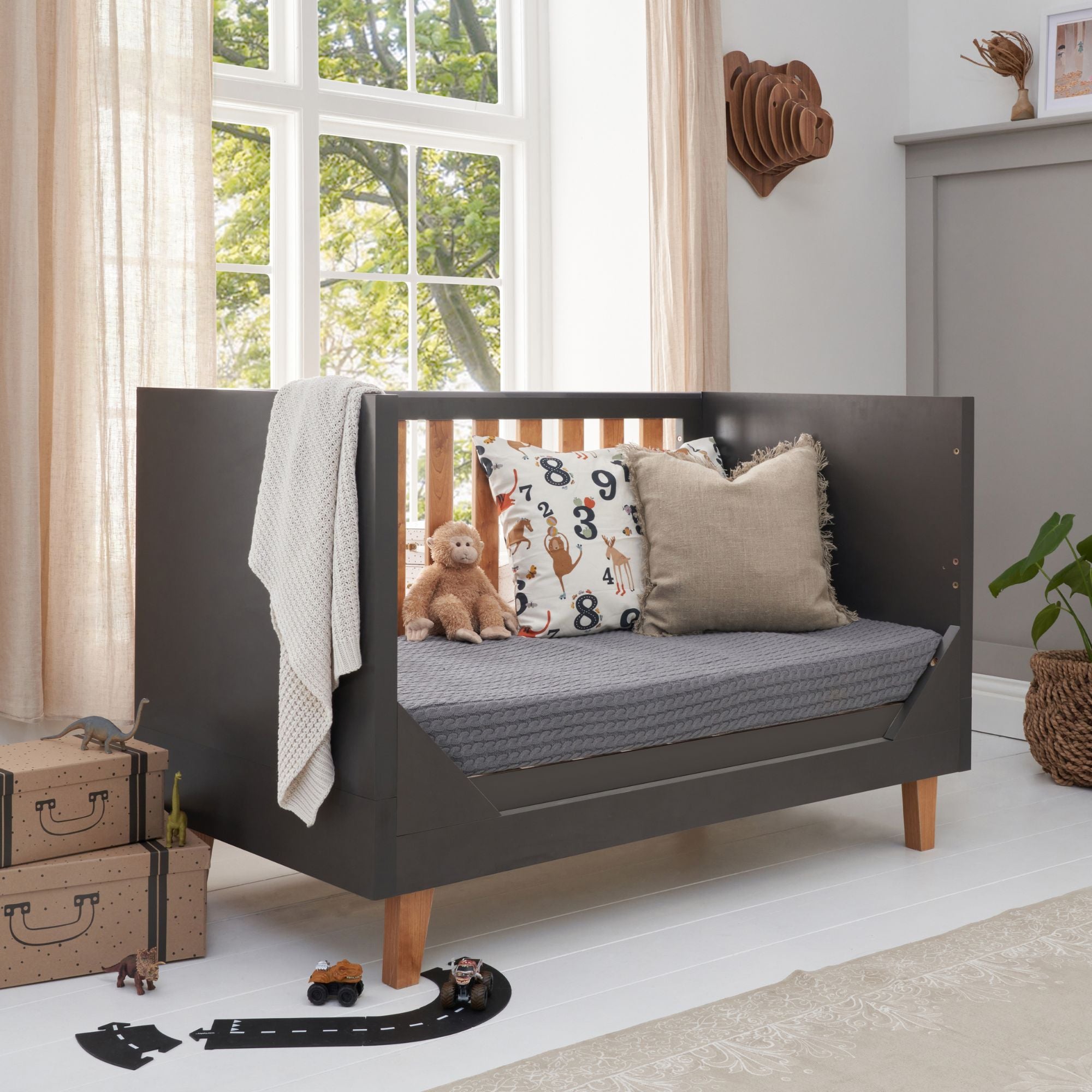 Como Cot Bed in Sofa mode in a modern nursery