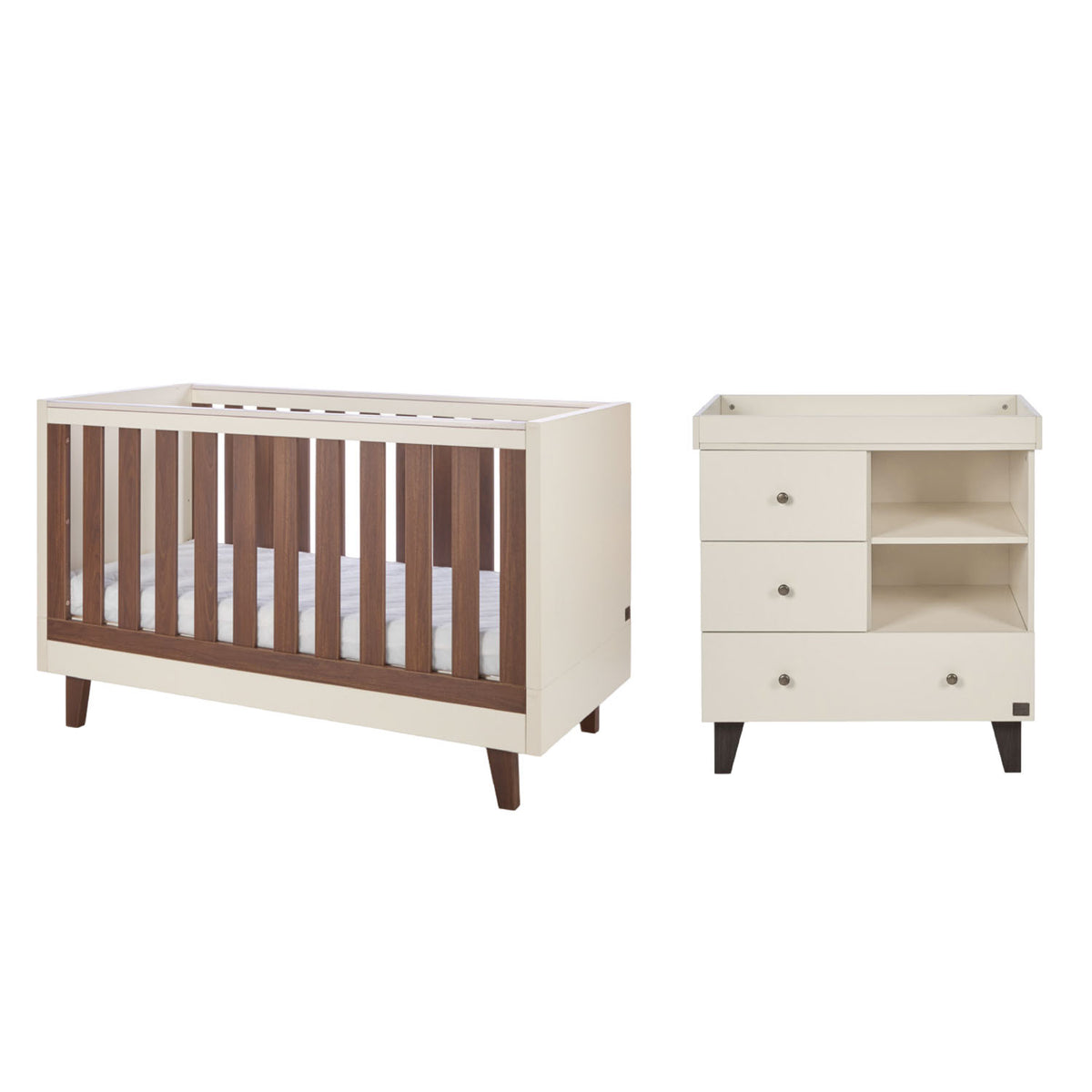 A cot bed and changing table set in cream and dark brown walnut wood, shown on a plain white background.
