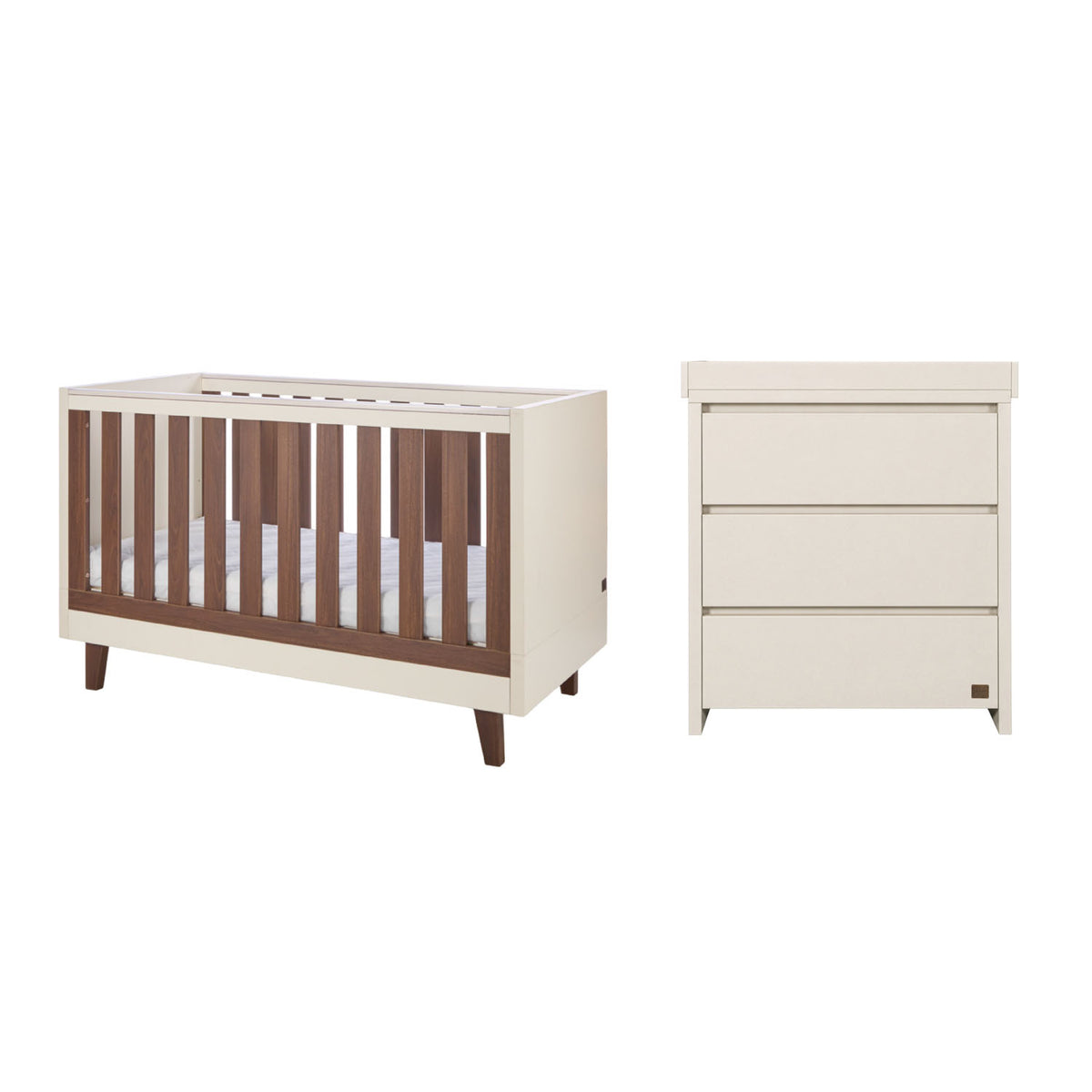A nursery furniture set featuring a convertible cot bed with dark brown wooden slats and cashmere cream-colored frame, paired with a matching three-drawer dresser in cream, shown on a plain white background.