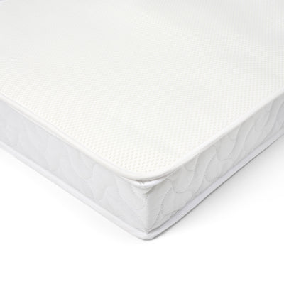 Corner view of breathable cot bed mattress with mesh cover and quilted sides for comfort and enhanced airflow