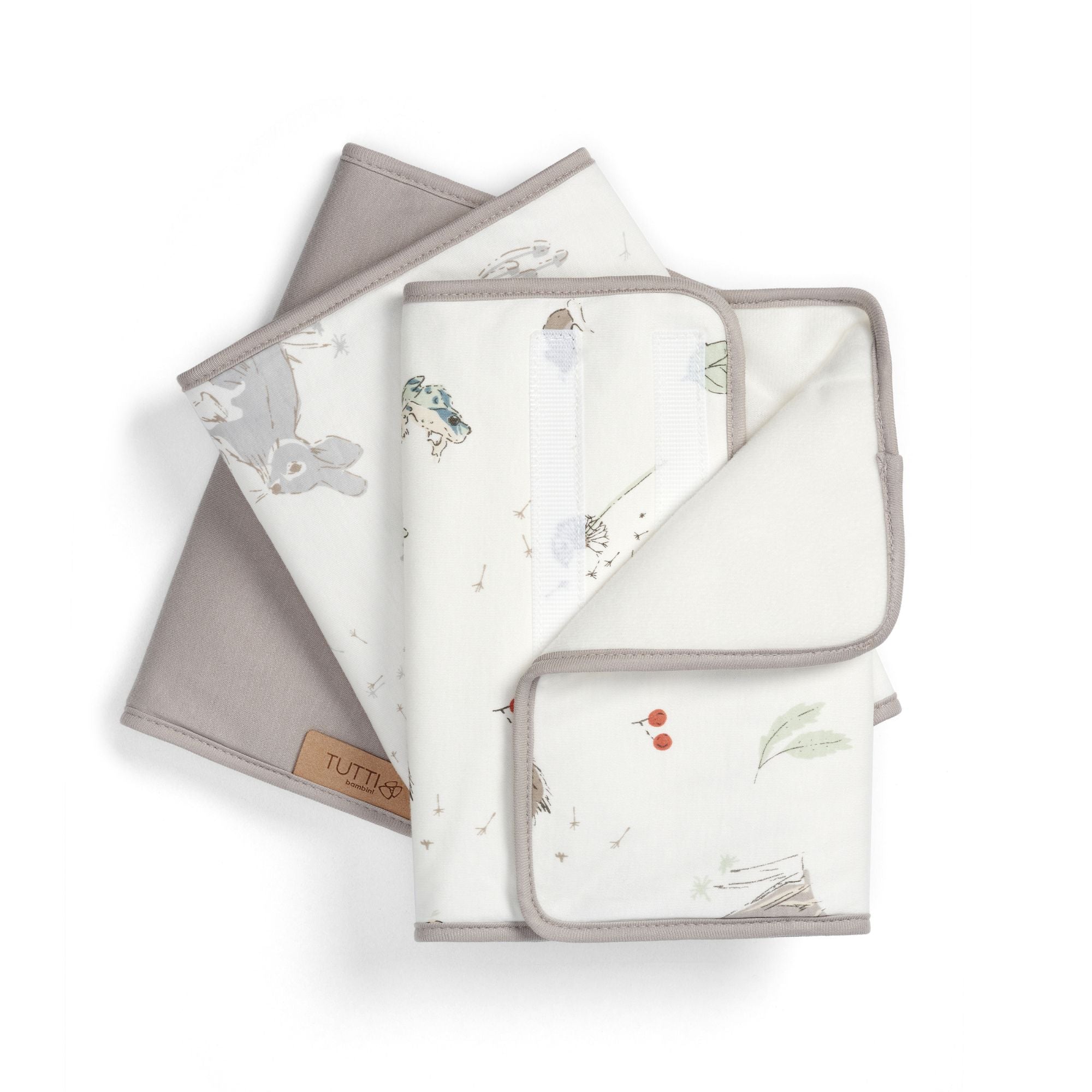 Set of six cot wraps with a woodland motif on a white background