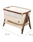 An infographic of a baby bedside crib with dimension markings showing 92 cm length, 56 cm width, and 69 to 84 cm height, on a plain white background.