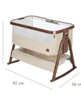 An infographic of a baby bedside crib with dimension markings showing 92 cm length, 56 cm width, and 69 to 84 cm height, on a plain white background.