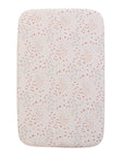 A bedside crib fitted sheets with a nature-inspired scatter print featuring tiny carrots, soft florals and subtle dotted details, on a white background