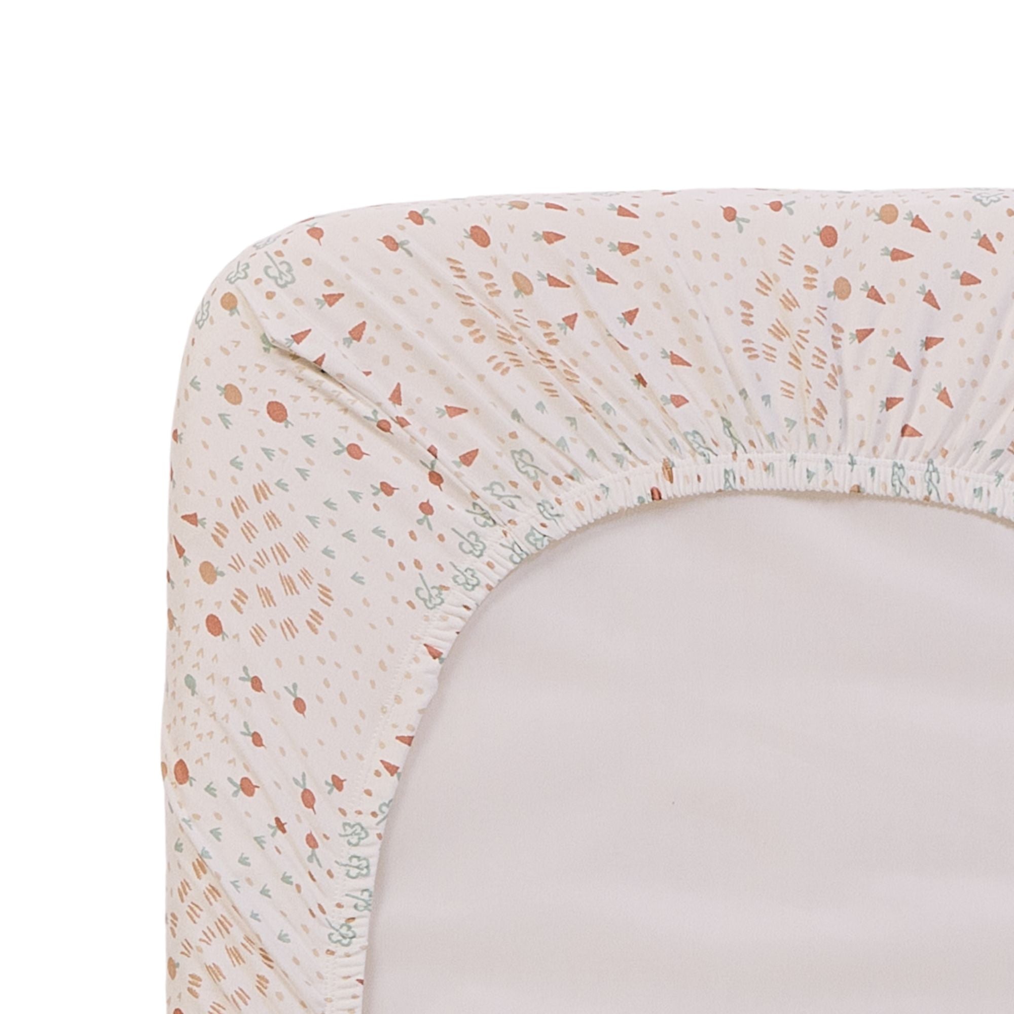 Close-up of the Good Life crib sheet with a nature-inspired pattern on a white background