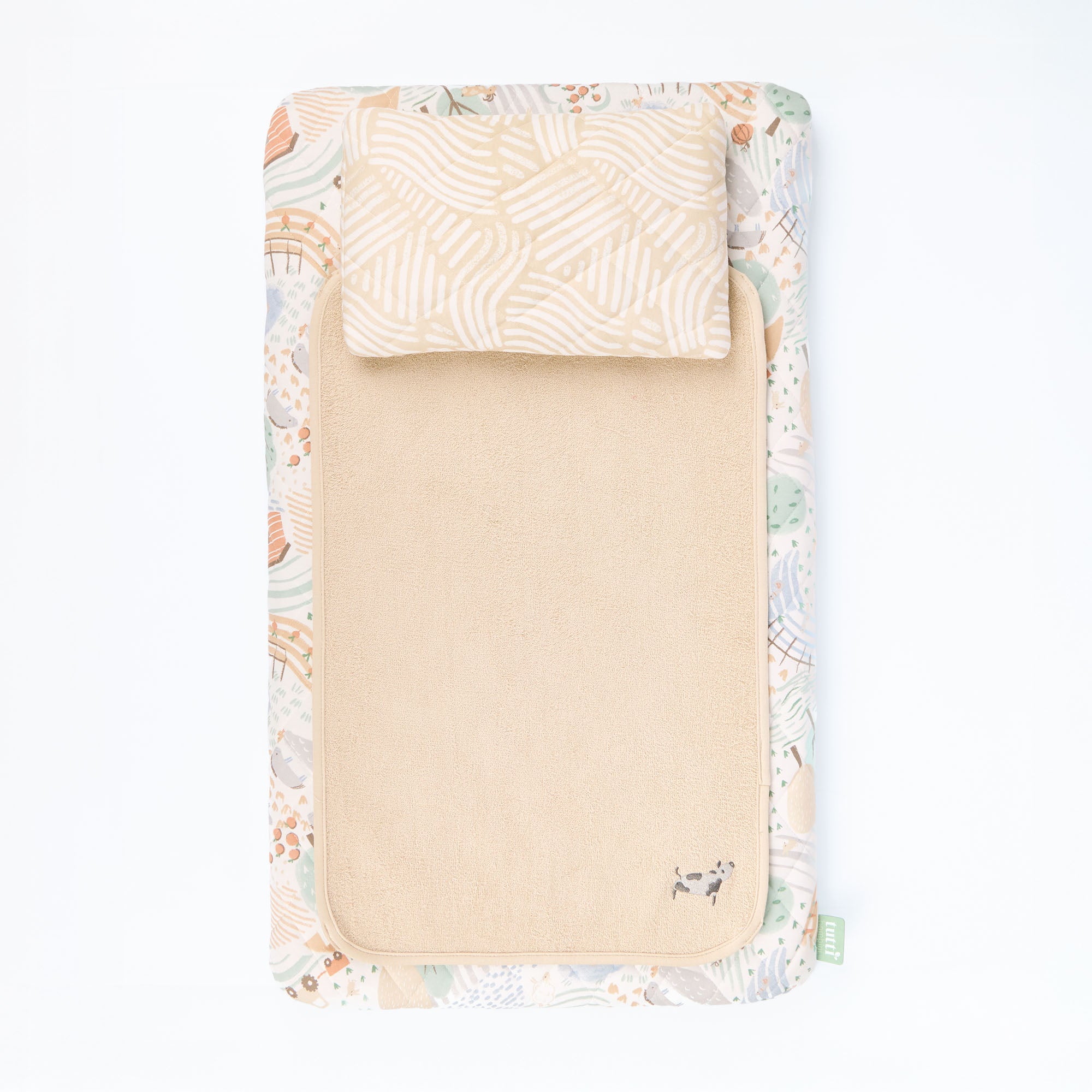 Good Life luxury changing pad with animal farm print on a white background