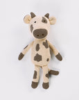 Knitted cow toy on a white background